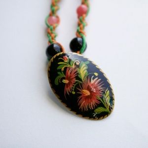 Handmade hemp necklace with green flower pendant